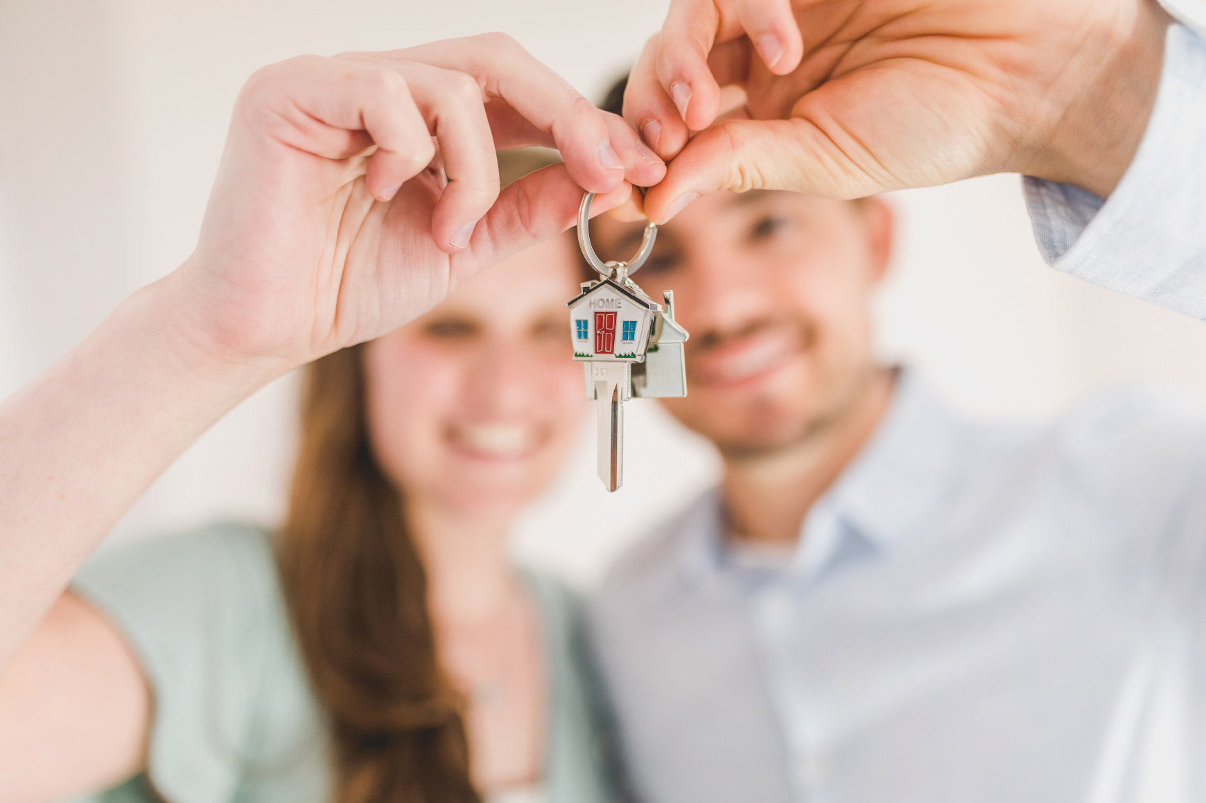 Couple holding house keys